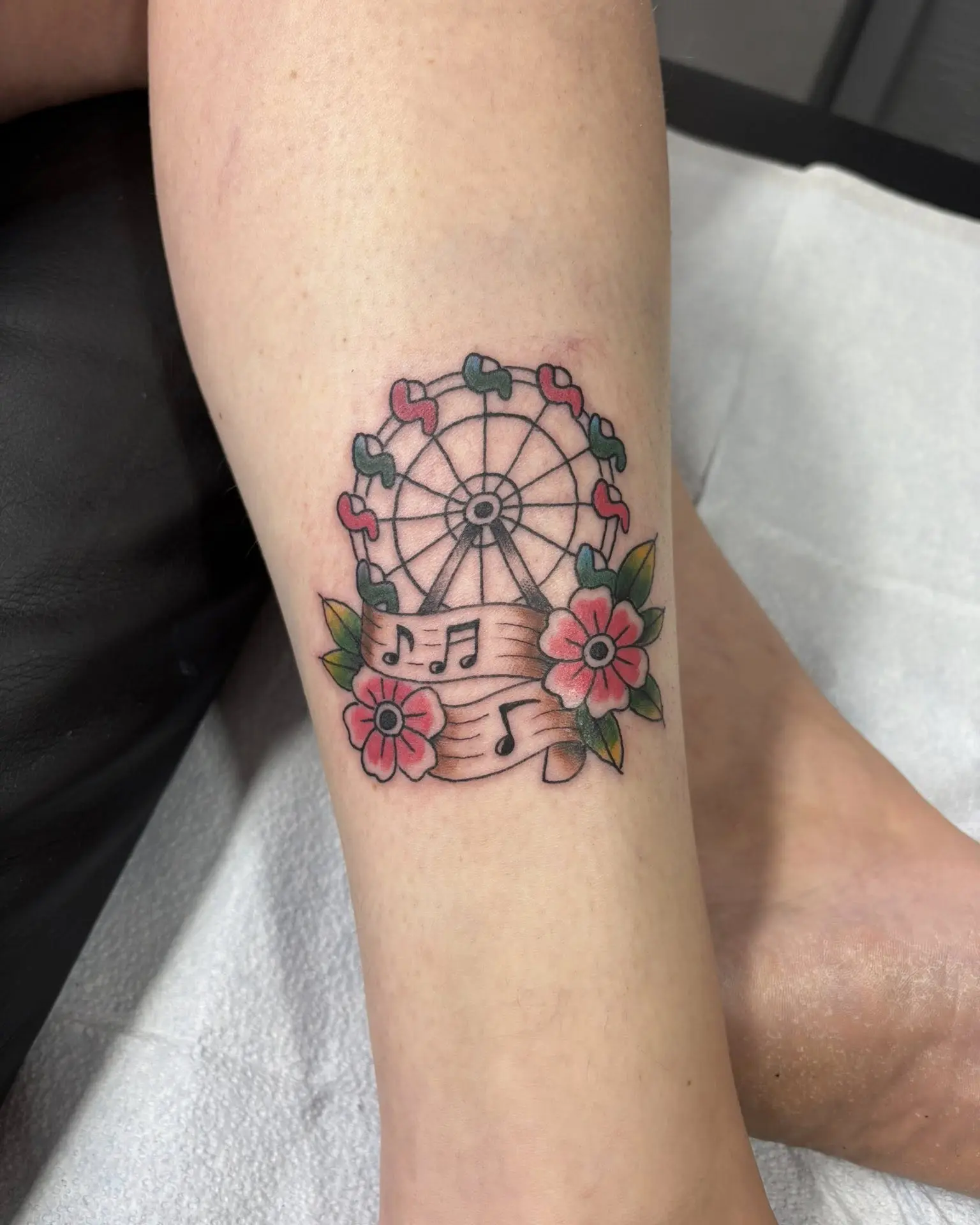 Whimsical Ferris Wheel Tattoo with Floral Details