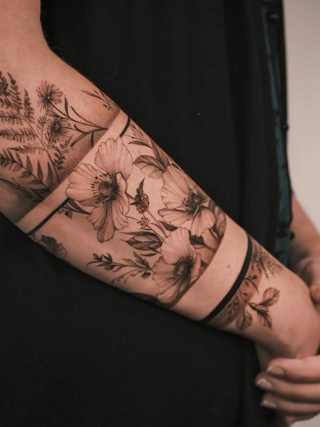 Elegant floral armband tattoo design inspiration