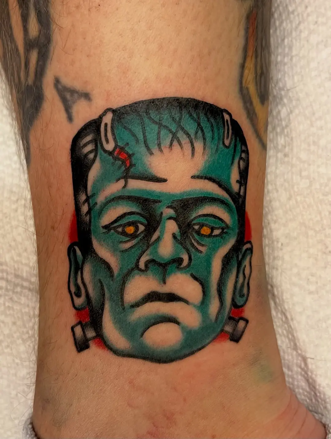 Striking Frankenstein Tattoo with Bold Colors