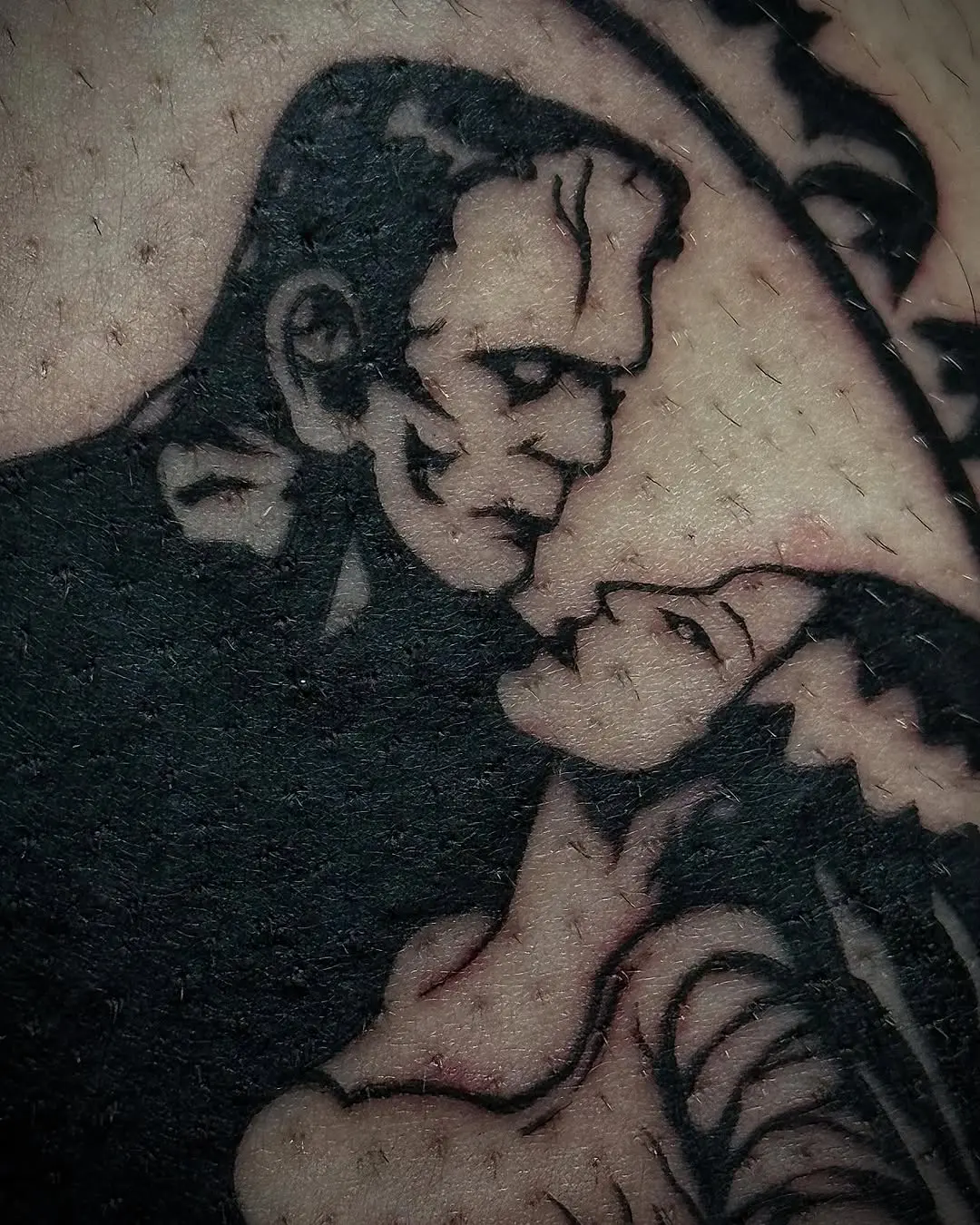 Iconic embrace of Frankenstein and his bride