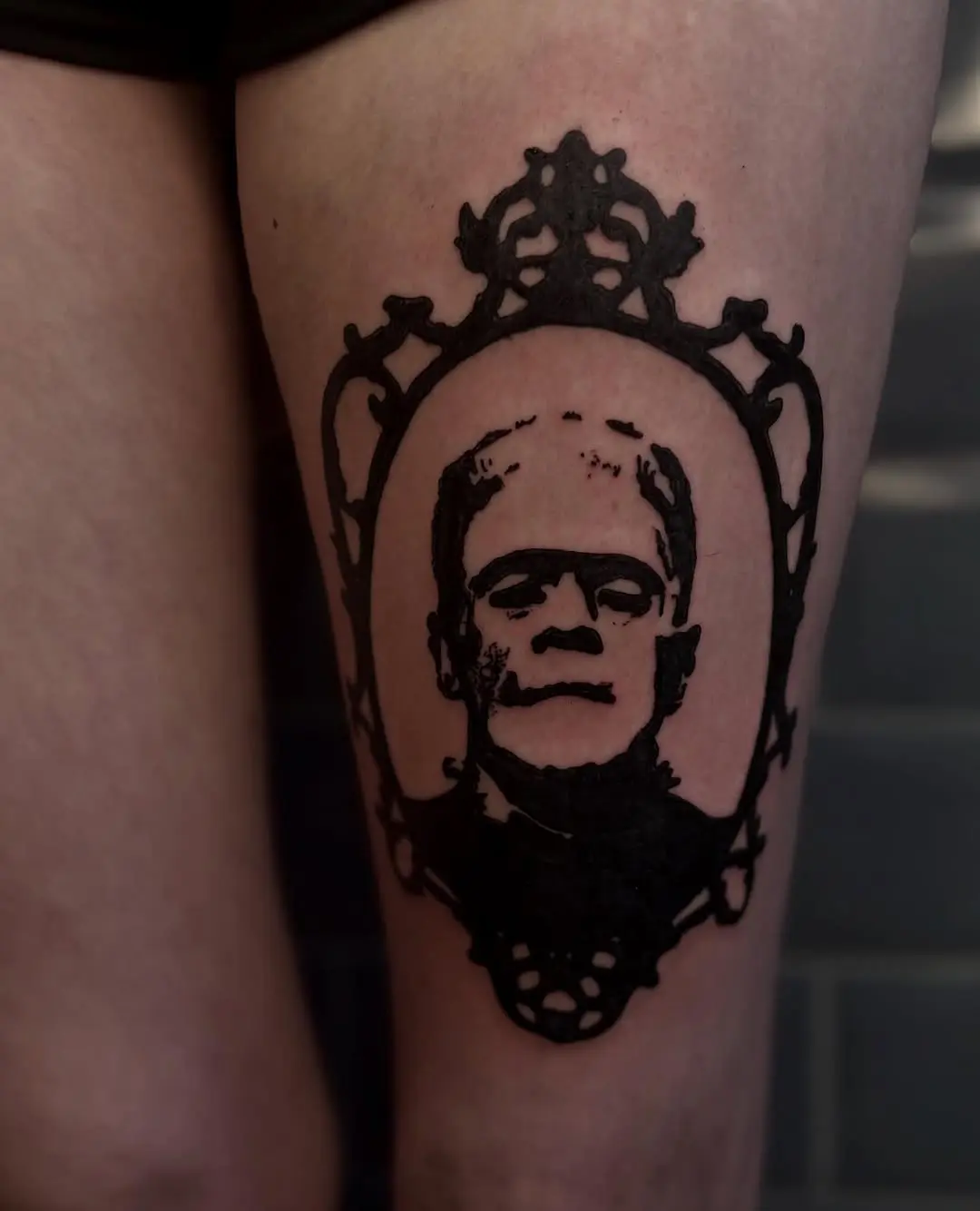 Striking portrait of Frankenstein in vintage frame.