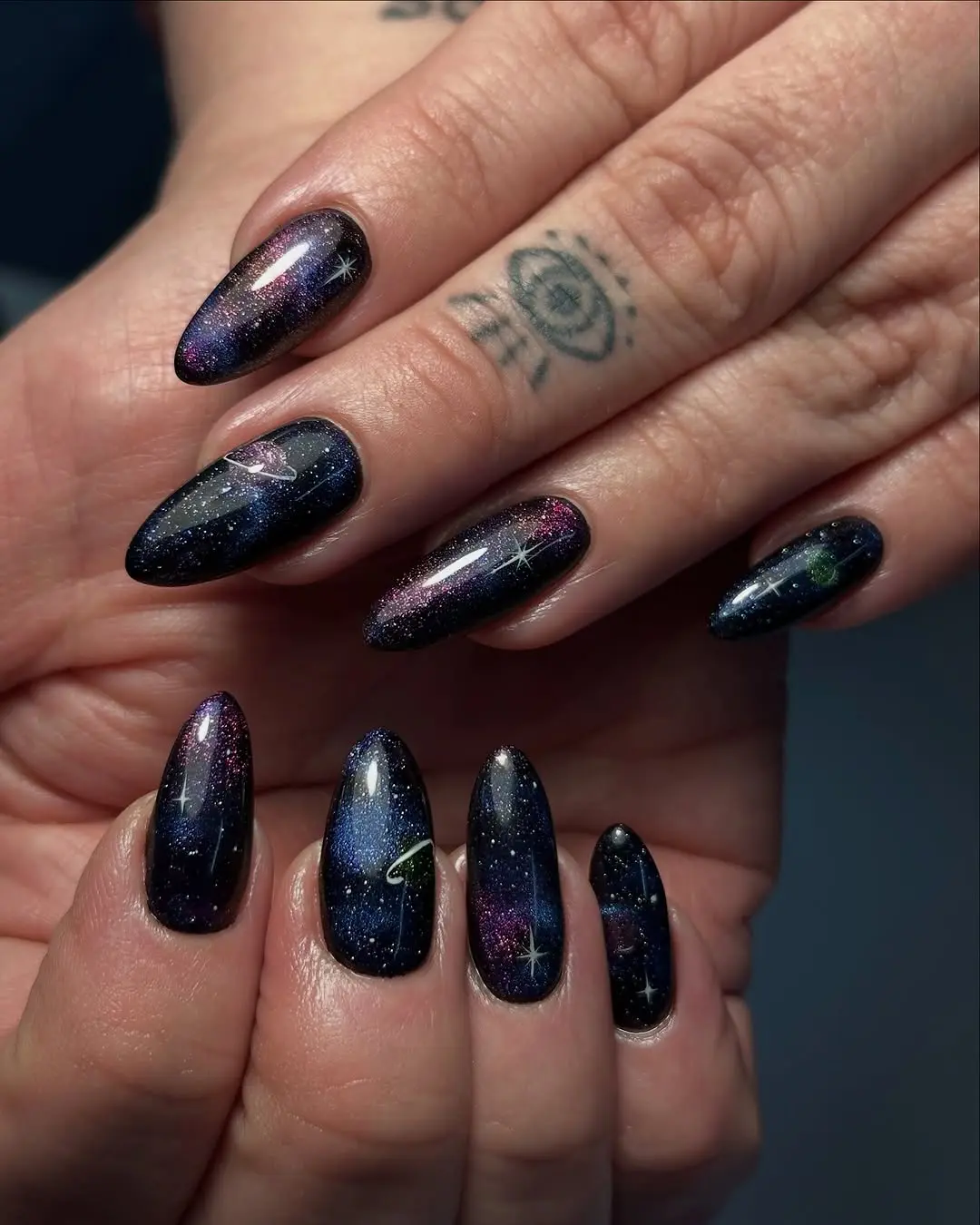 Stunning galaxy-themed nail art with sparkles