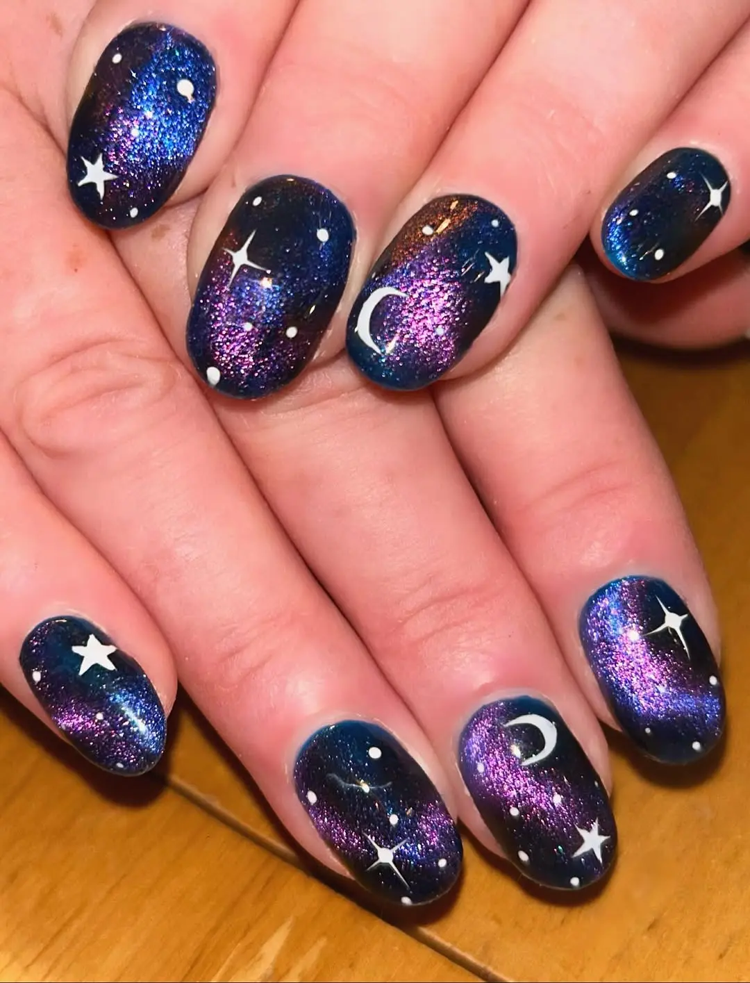 Stunning galaxy-themed nails with cosmic patterns