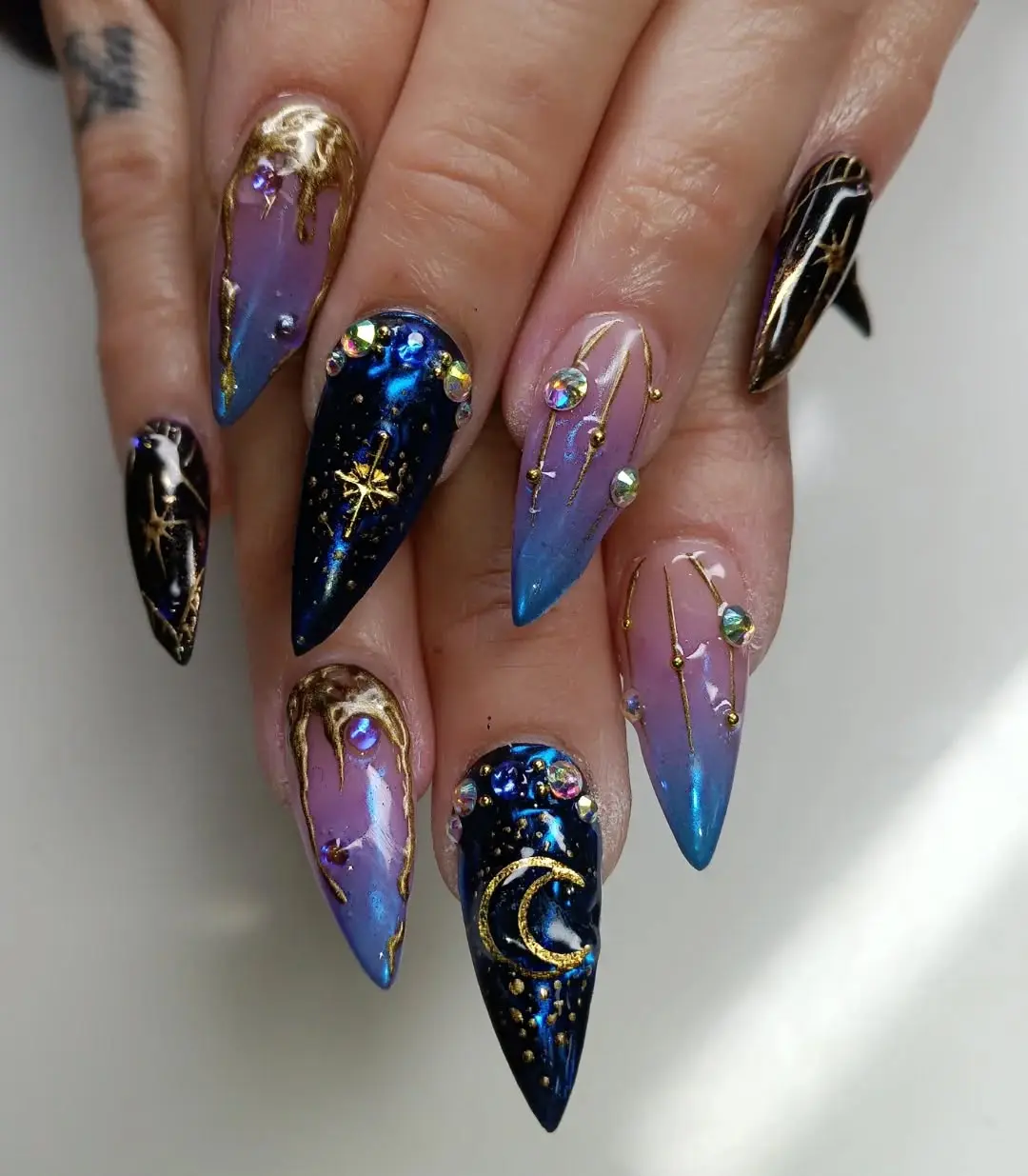 Stunning galaxy-inspired nail art design