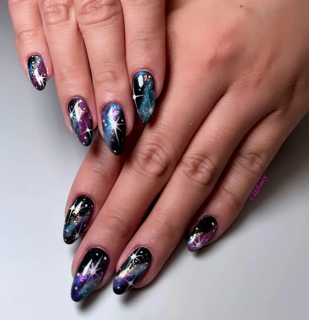 Mesmerizing galaxy nails with glittery accents