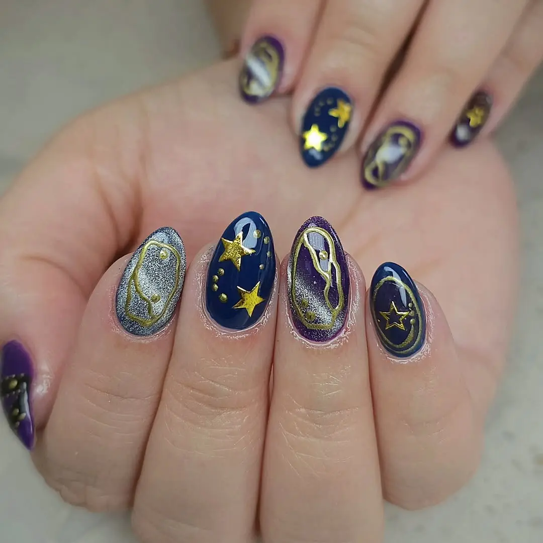 Stunning galaxy nails with metallic accents