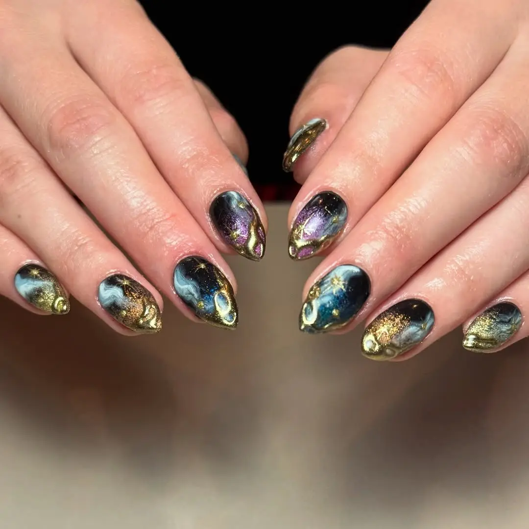 Stunning galaxy nails with golden tips