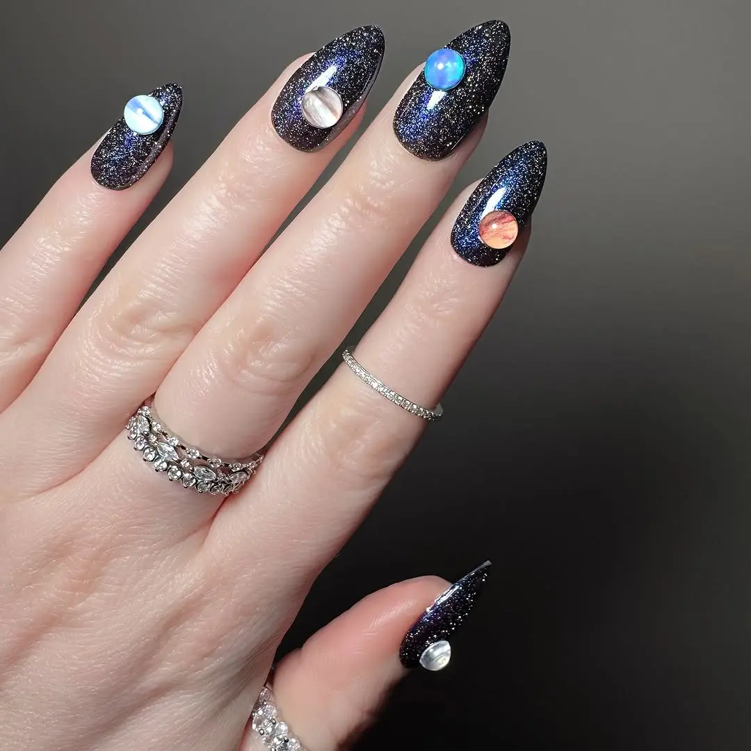 Stunning Galaxy-Inspired Nails with Glam Stones