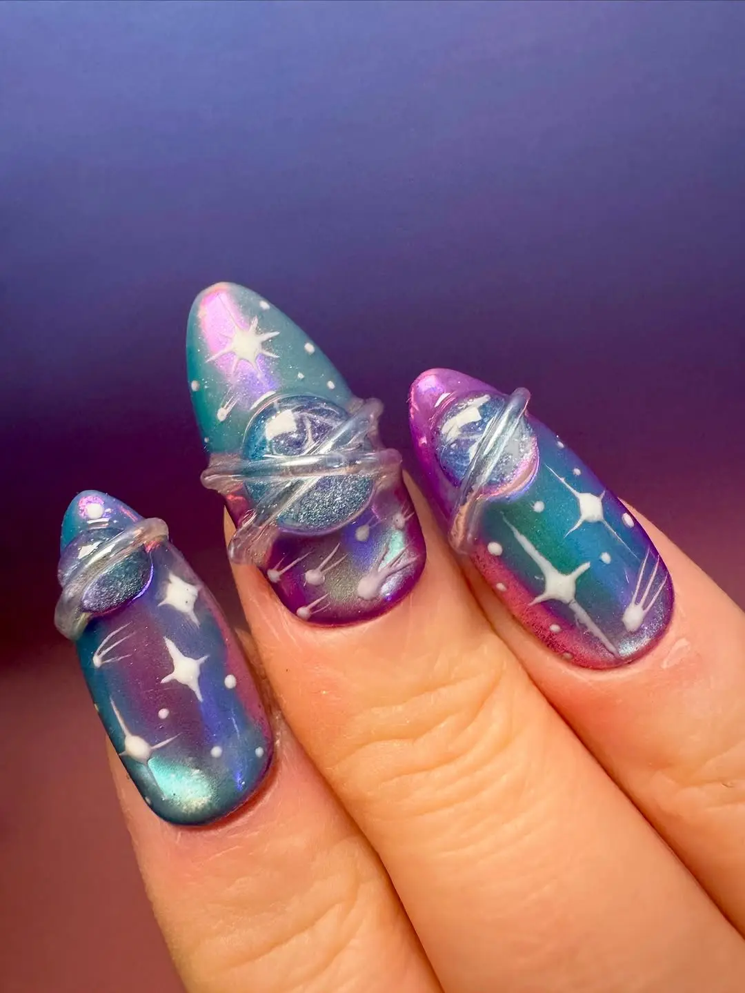 Cosmic-inspired nails with stunning designs