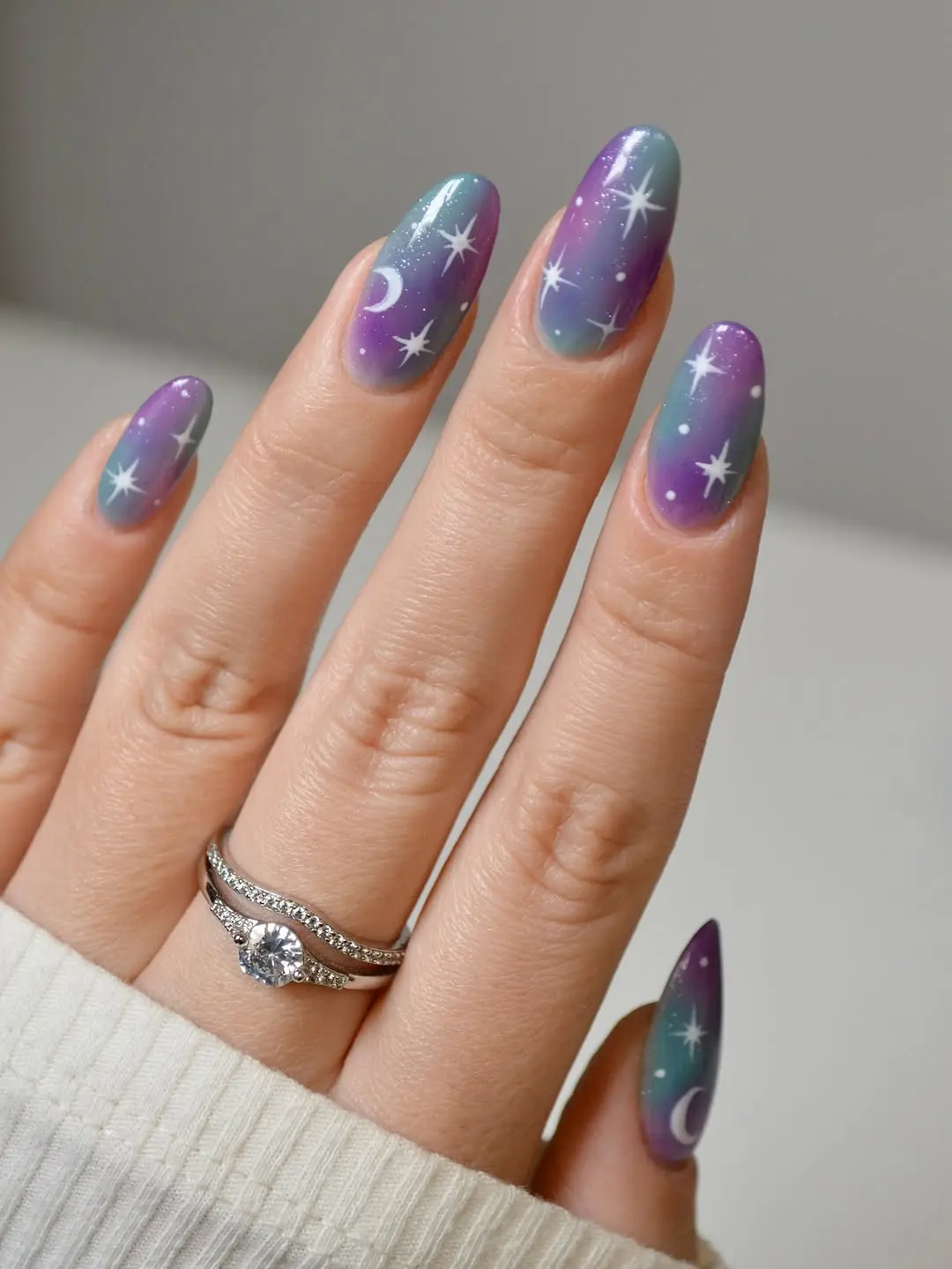 Stunning galaxy-themed nails with cosmic elements