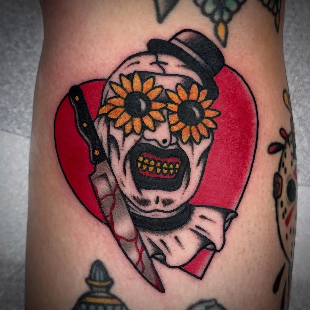 Creepy clown tattoo with flower eyes