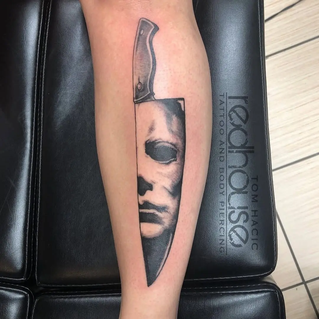 Creepy knife tattoo inspired by horror films