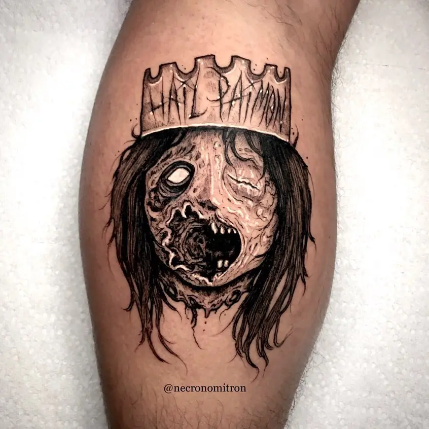 Chilling horror tattoo depicting a crowned figure