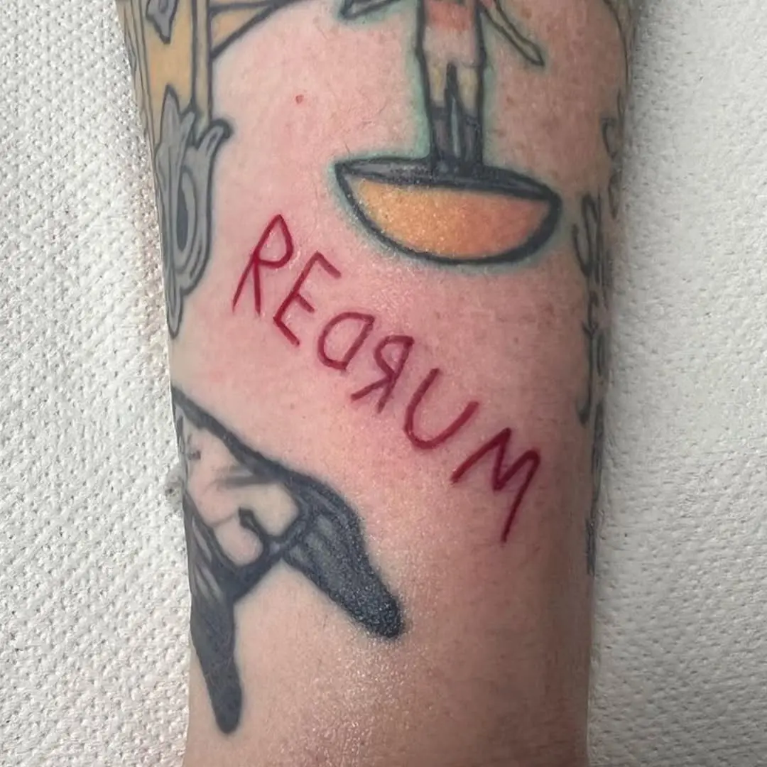 Intriguing Redrum Tattoo on Forearm