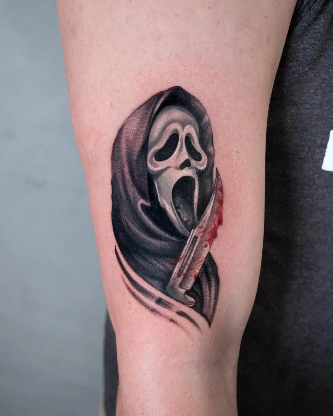 Intricate Scream Mask Tattoo with Blood Effects