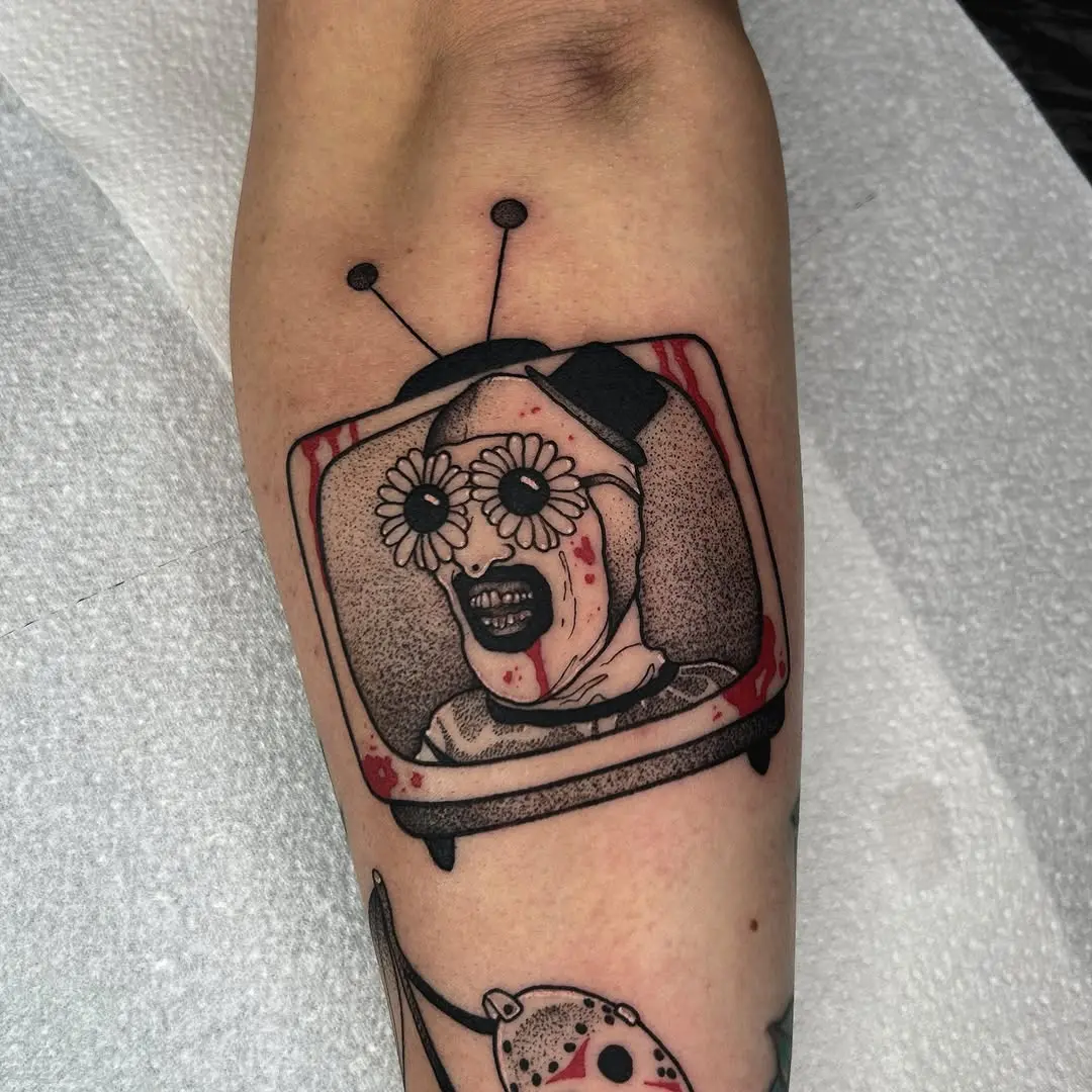 Unique horror tattoo featuring a vintage TV character