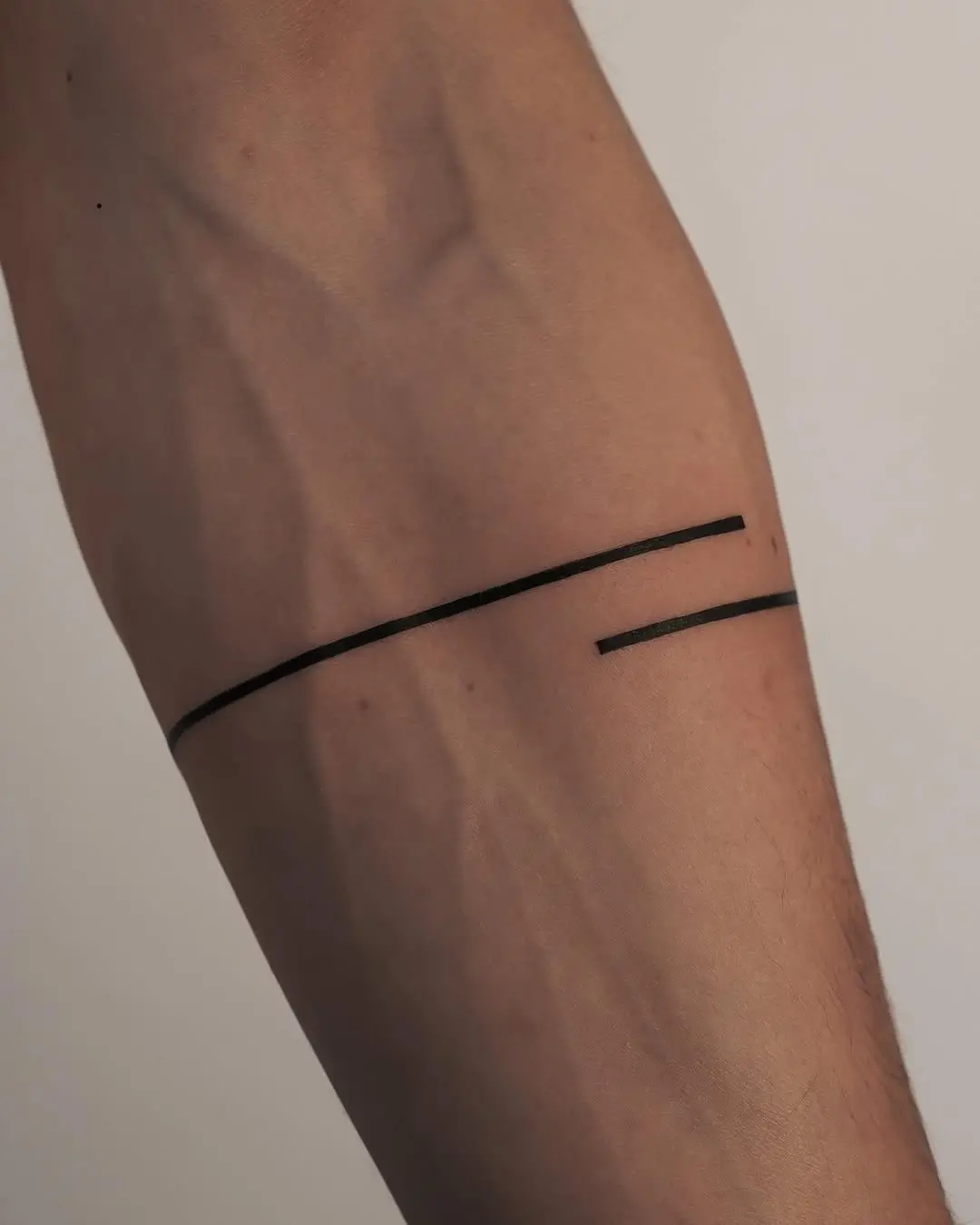 Sleek and modern minimalist armband tattoo