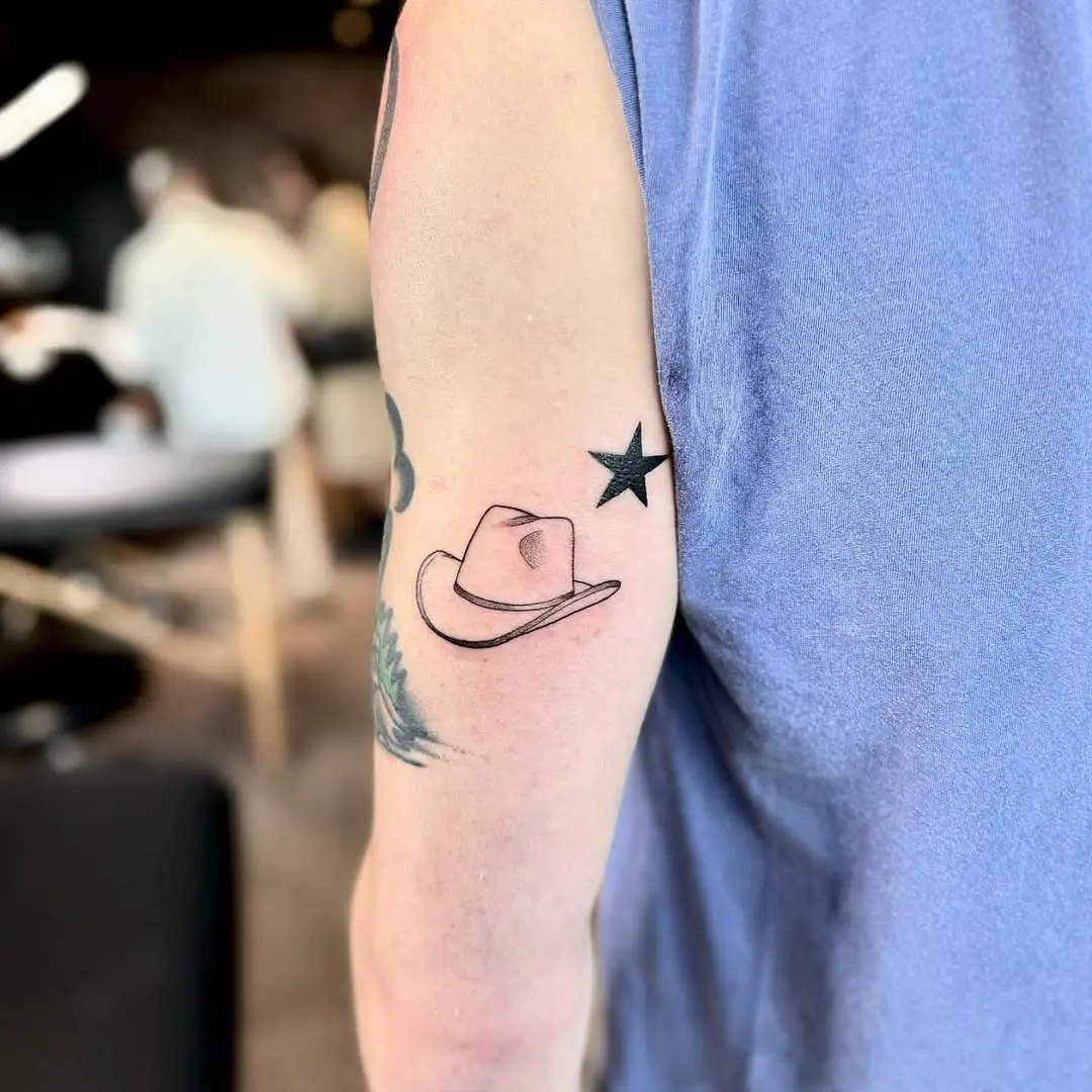 Stylish minimalist cowboy and star tattoo design
