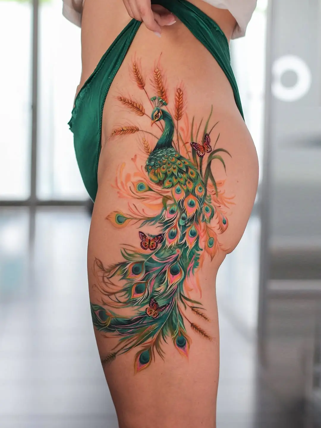 Stunning peacock tattoo showcasing vibrant colors
