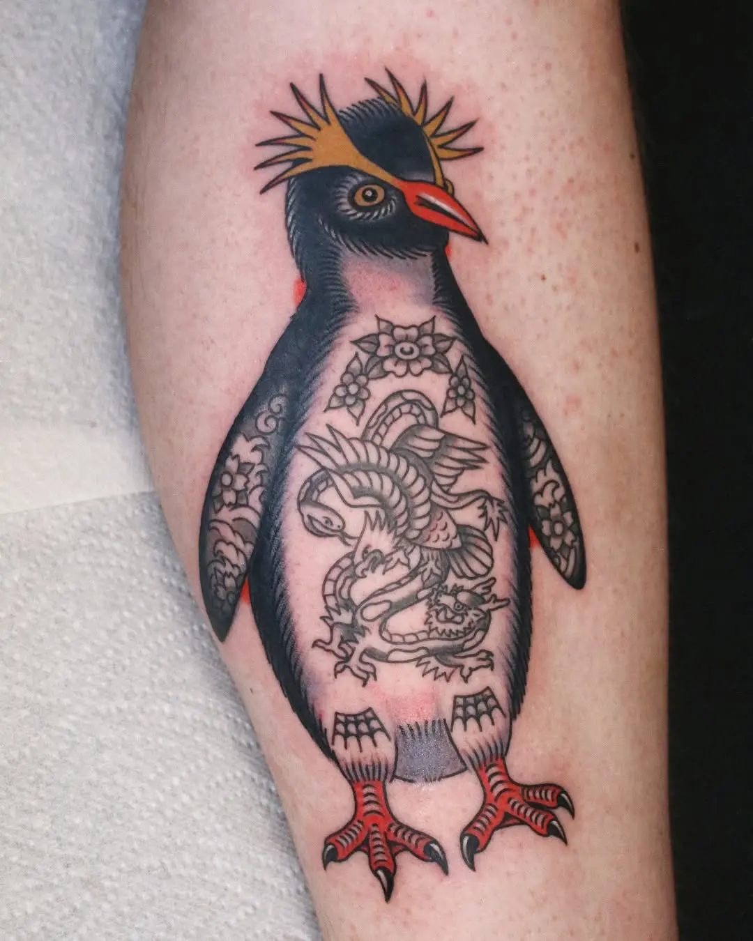 Unique penguin tattoo with intricate details