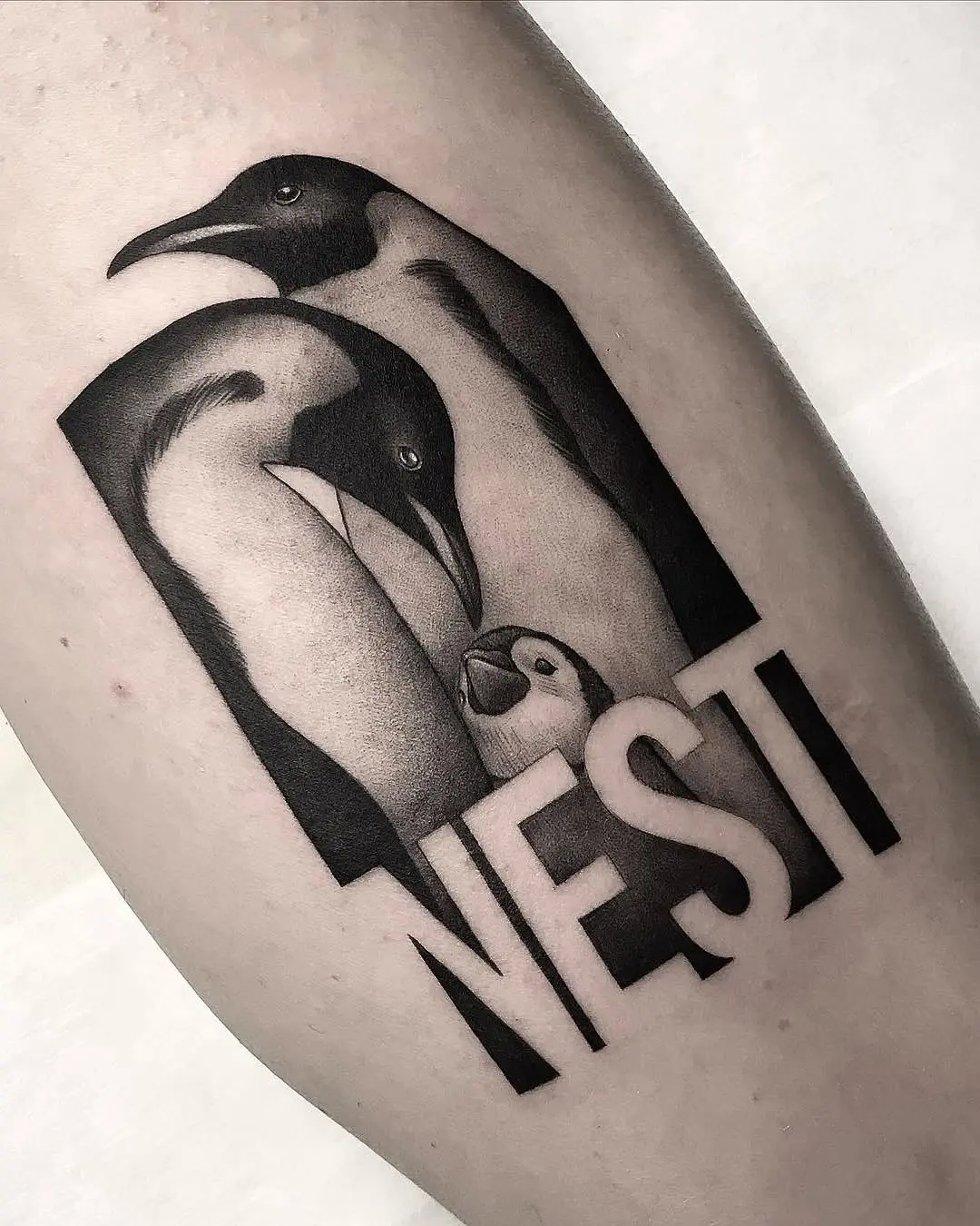 Adorable penguin family tattoo with meaning