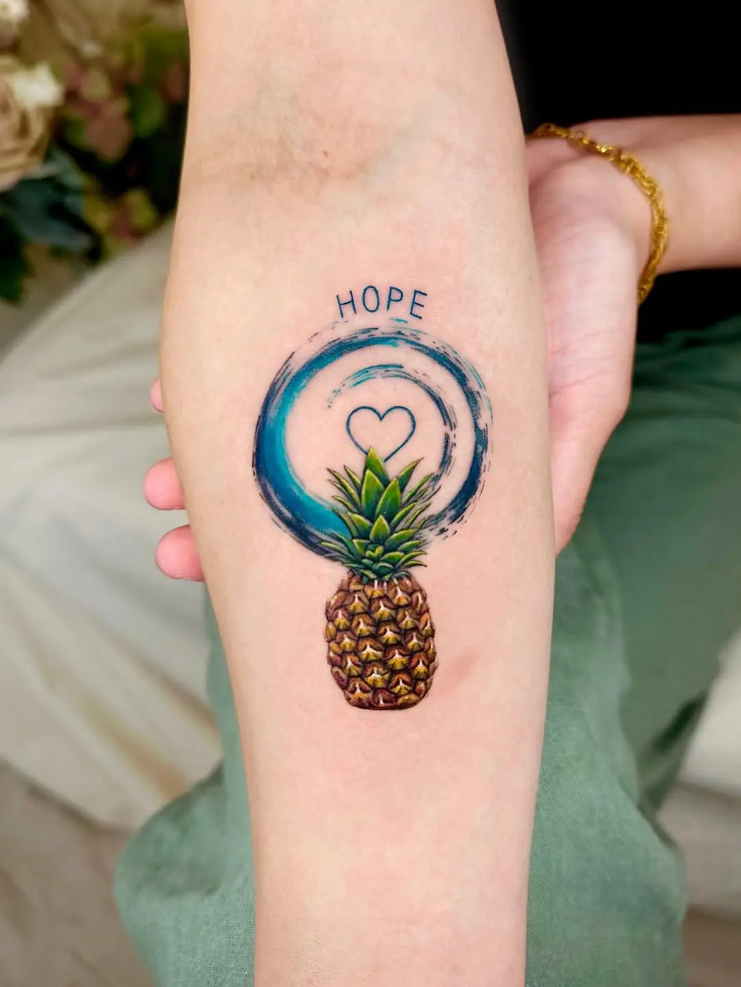 Colorful pineapple tattoo with a hopeful vibe