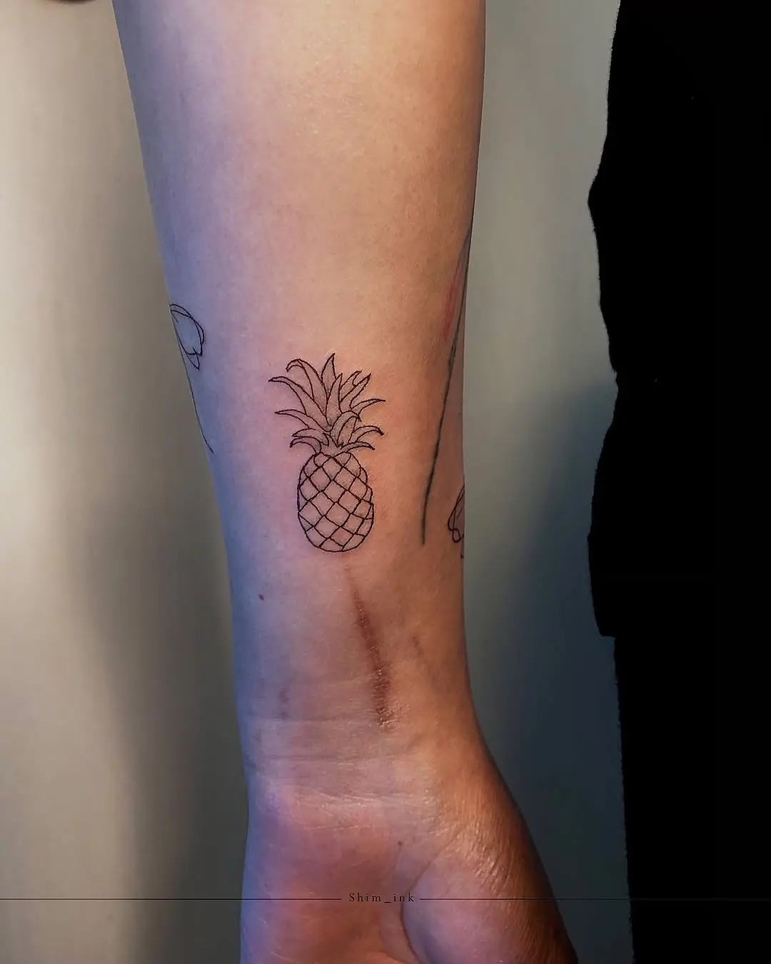 Stylish minimalist pineapple tattoo design