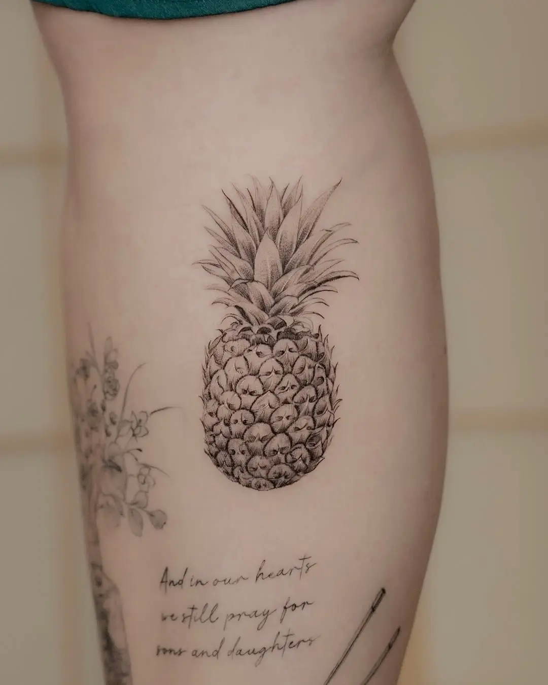 Stylish pineapple tattoo on thigh
