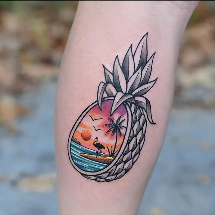Vibrant tattoo with a tropical sunset scene