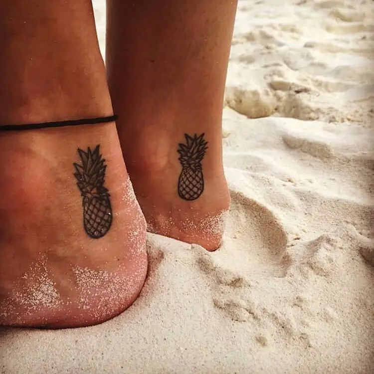 Fresh and fun pineapple tattoo on feet