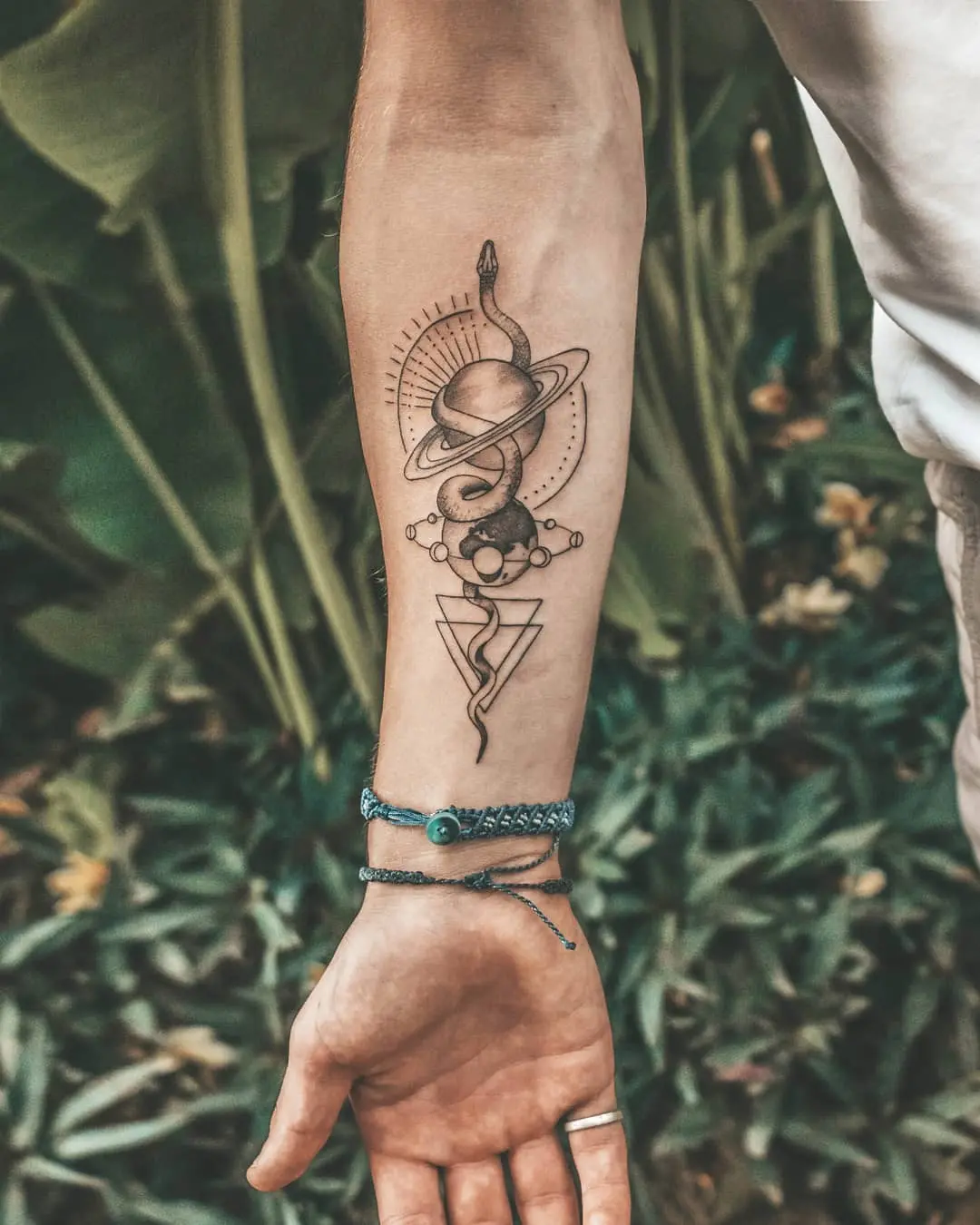 Intricate cosmic-themed earth tattoo design