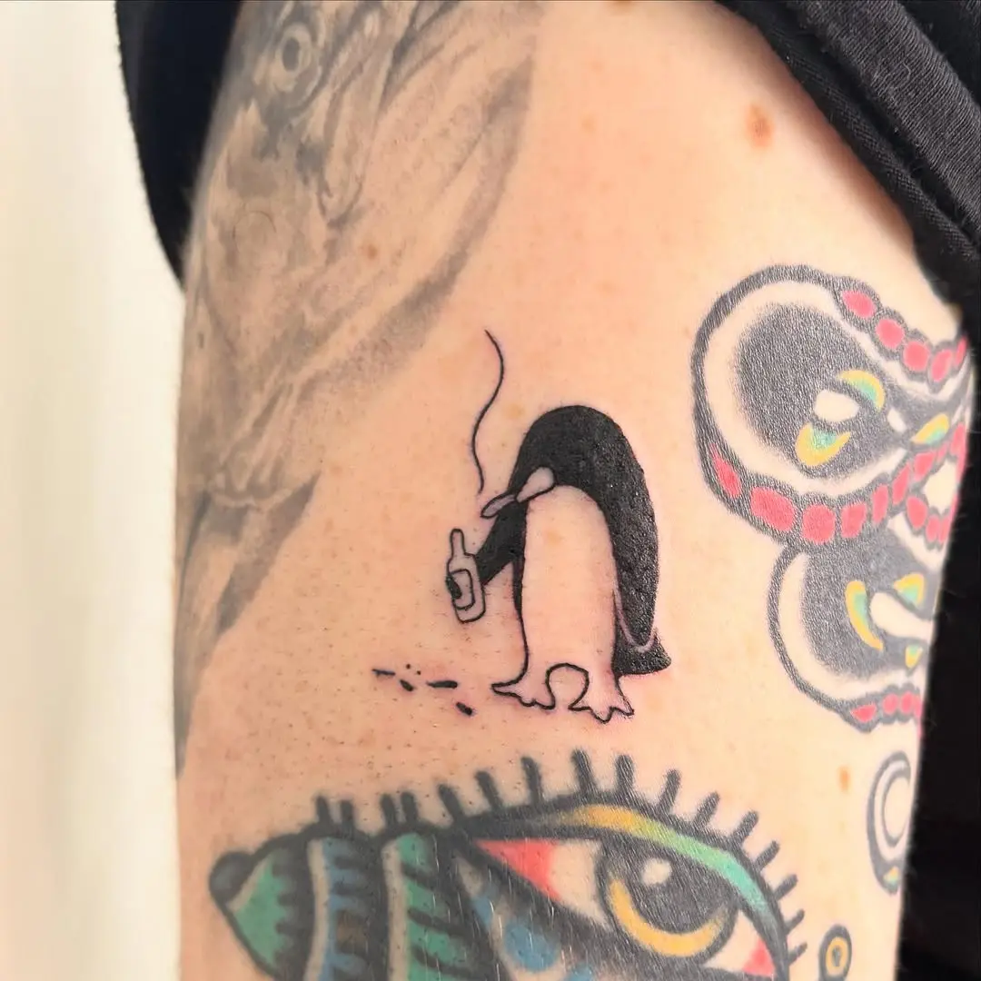 Charming penguin tattoo with a unique twist