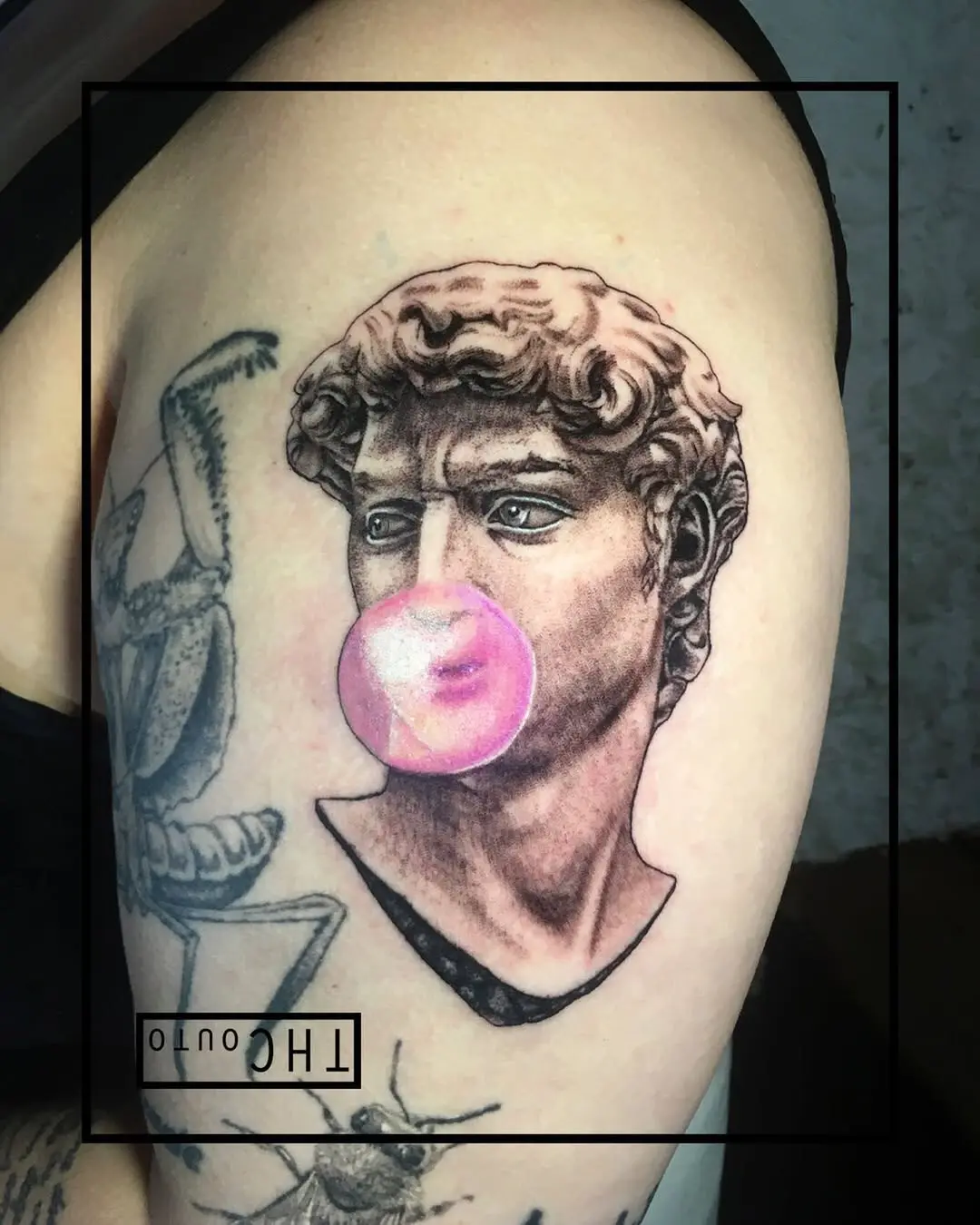 Playful twist on classic sculpture tattoo