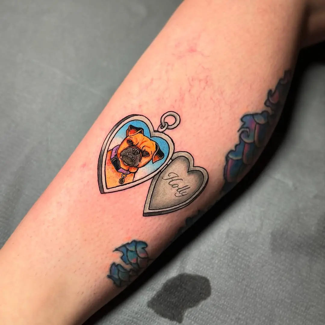 Whimsical locket tattoo showcasing loving pet