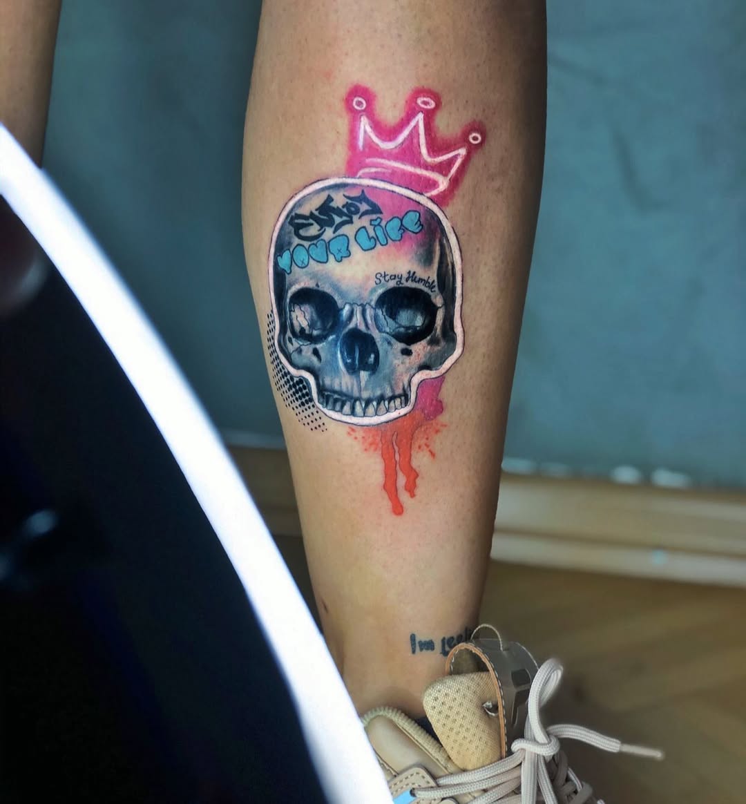Vibrant skull tattoo with crown design