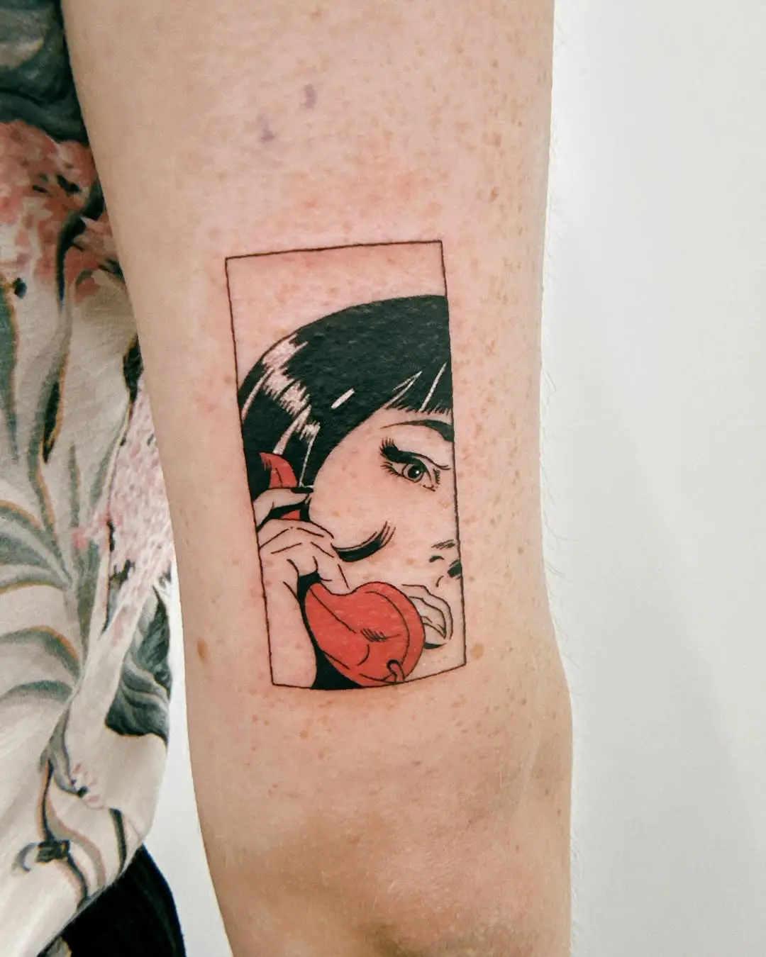 Vintage phone pop art tattoo with striking visuals