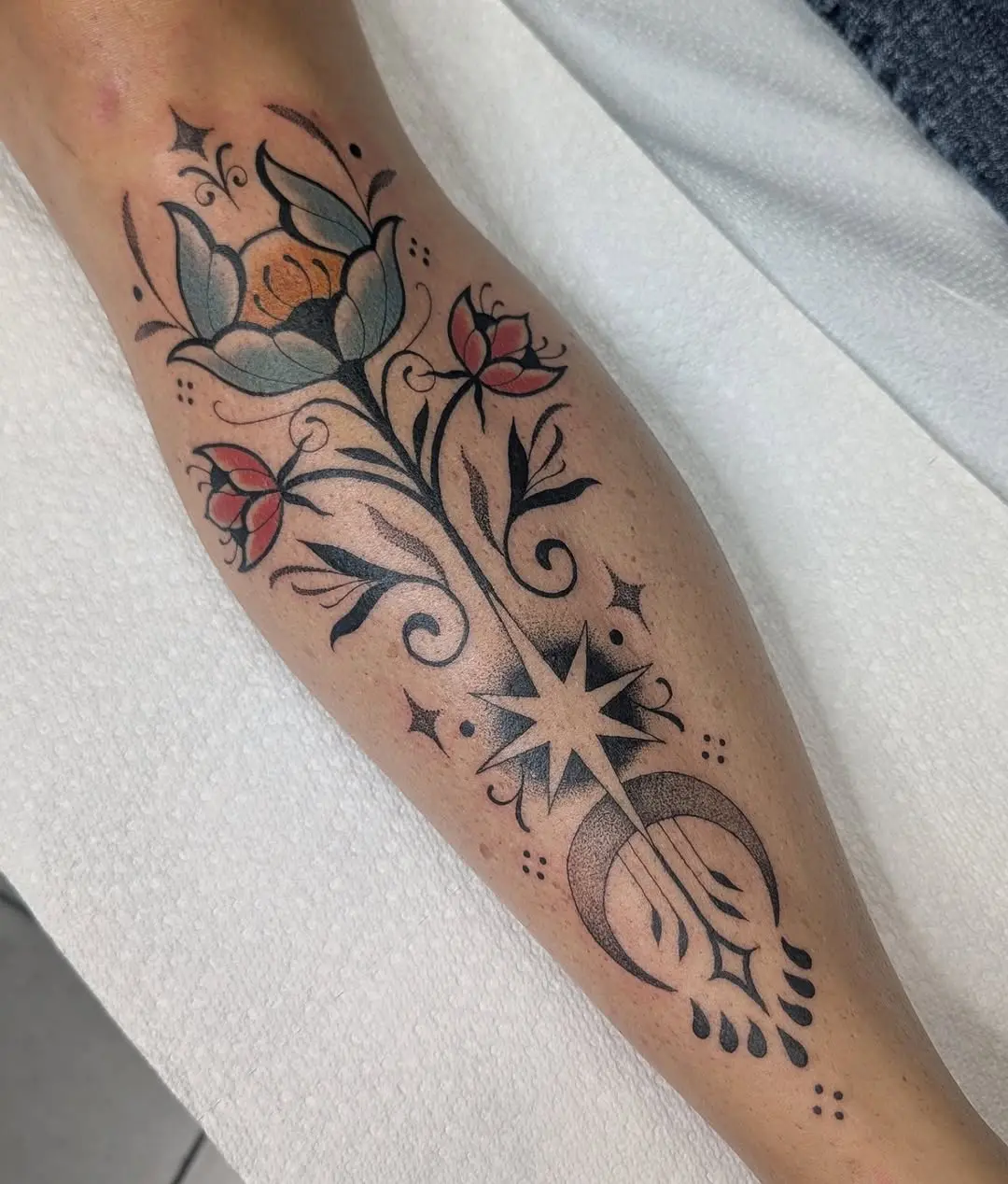 Elegant Floral and Celestial Shin Tattoo