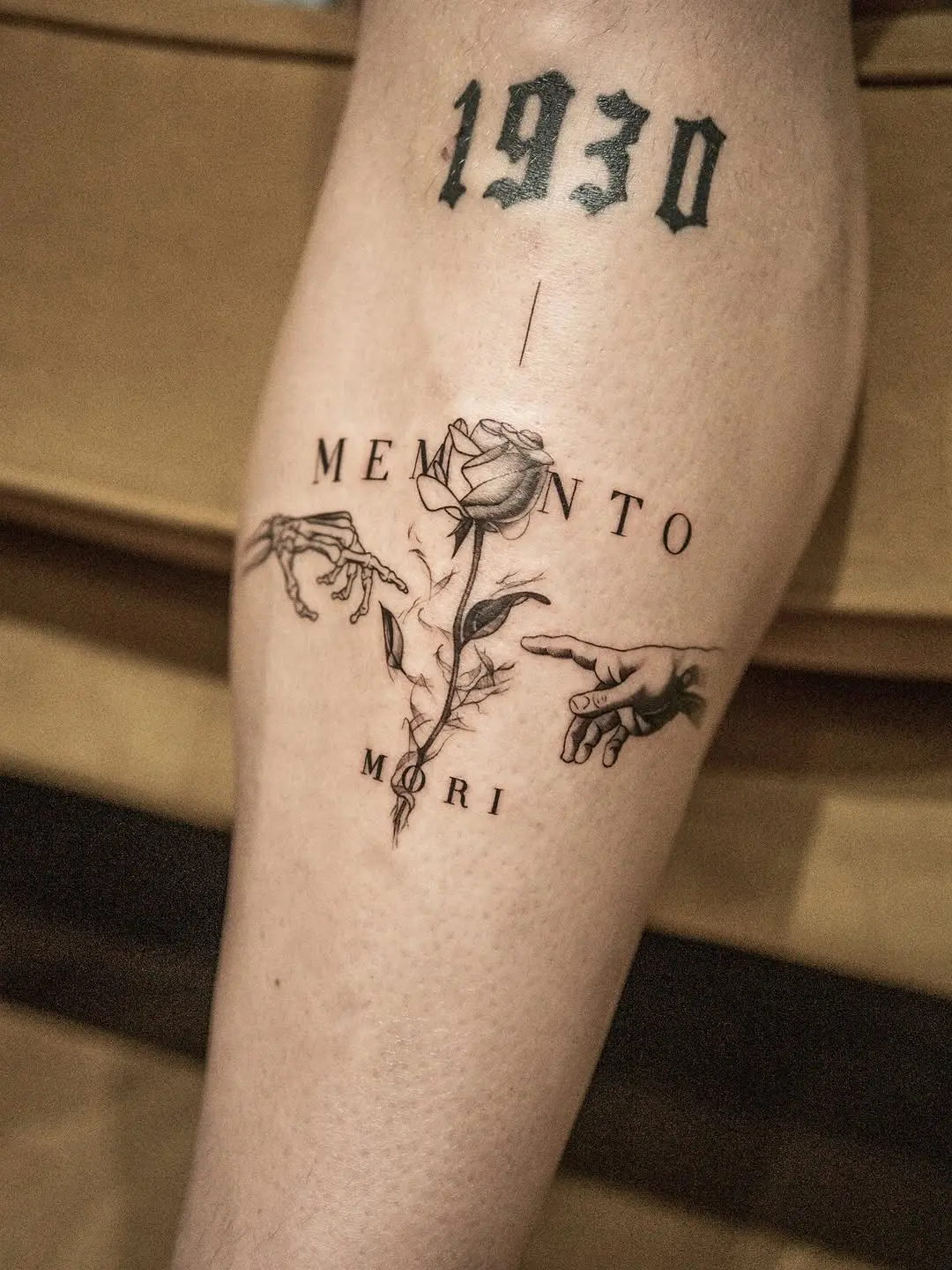 Intricate memento mori shin tattoo design
