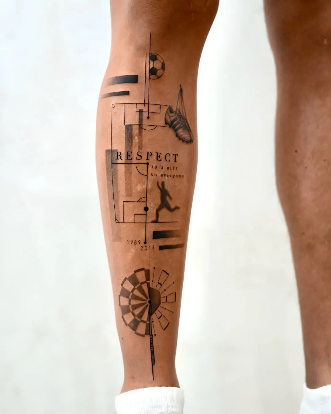 Symbolic and modern shin tattoo design