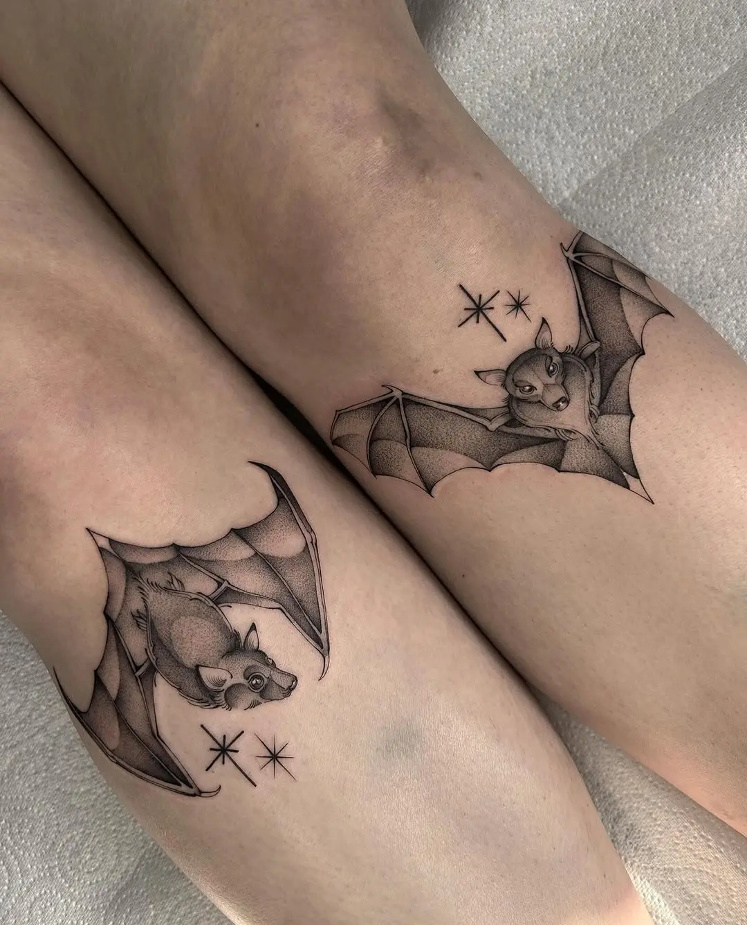 Unique bat tattoos on shin for bold vibes