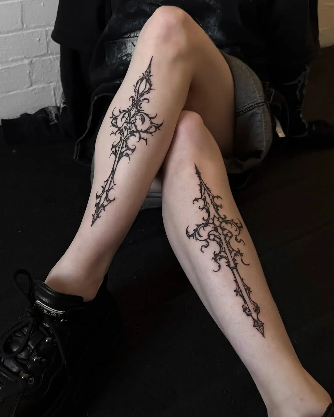 Intricate cross tattoos with gothic vibes