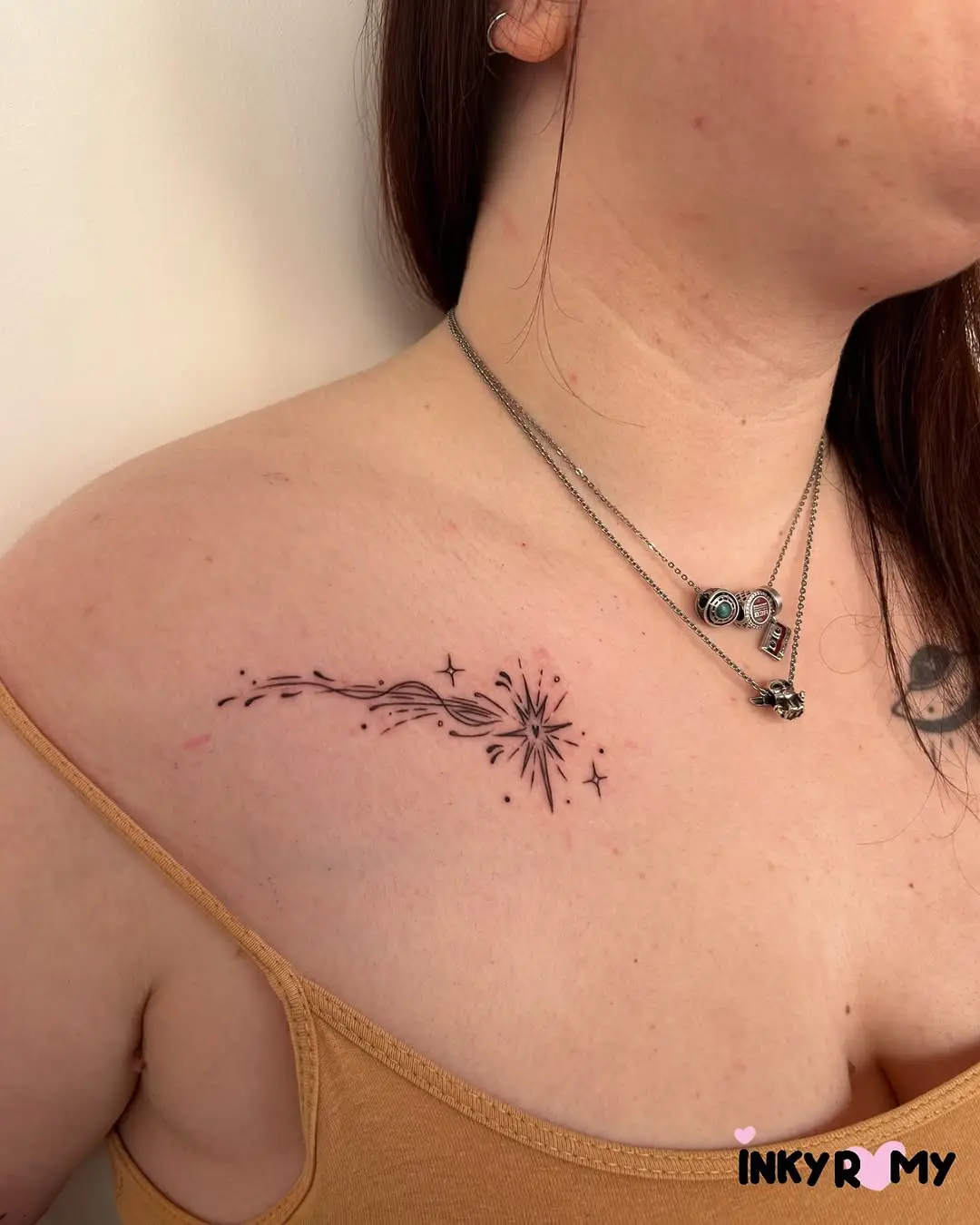 Elegant shooting star tattoo on the shoulder