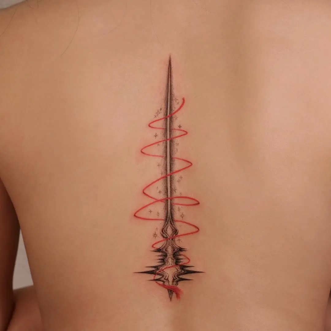 Elegant shooting star tattoo with spiral design