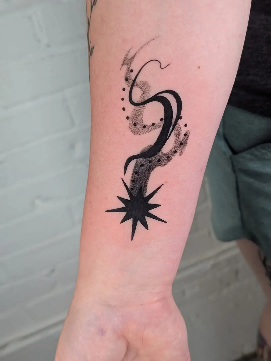 Minimalist Shooting Star Tattoo on Arm