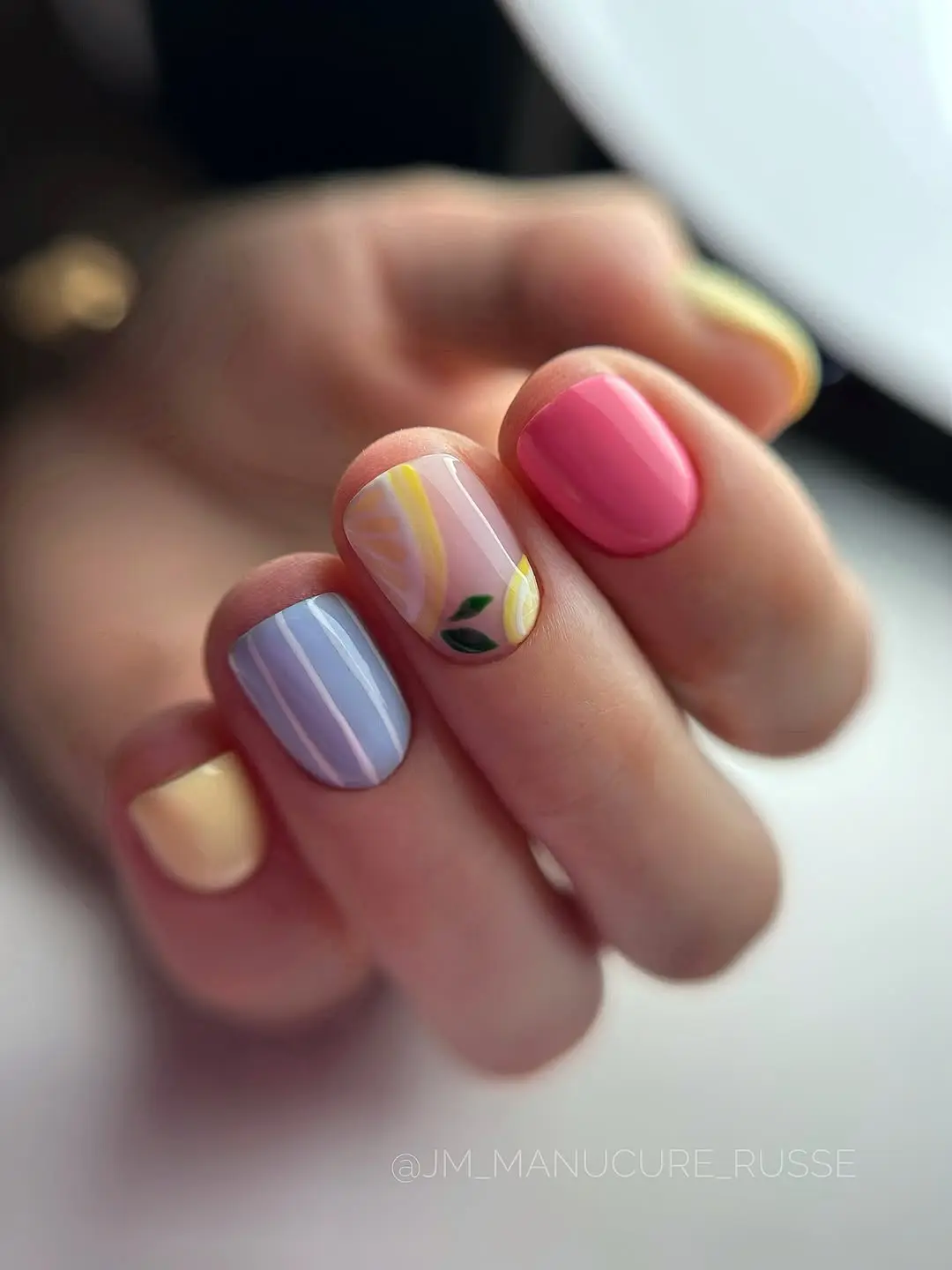 Vibrant short nails with floral designs