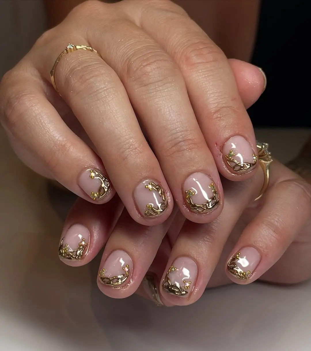 Chic short nails with elegant gold accents