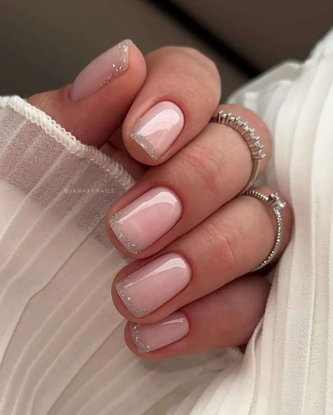 Chic Short Nails with Subtle Glitter Accents