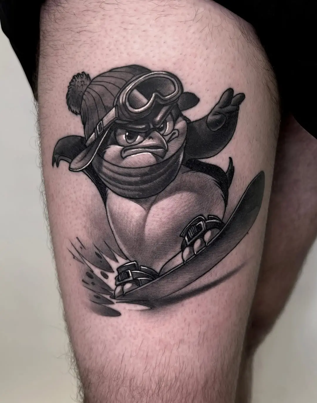 Dynamic penguin tattoo showcasing winter fun