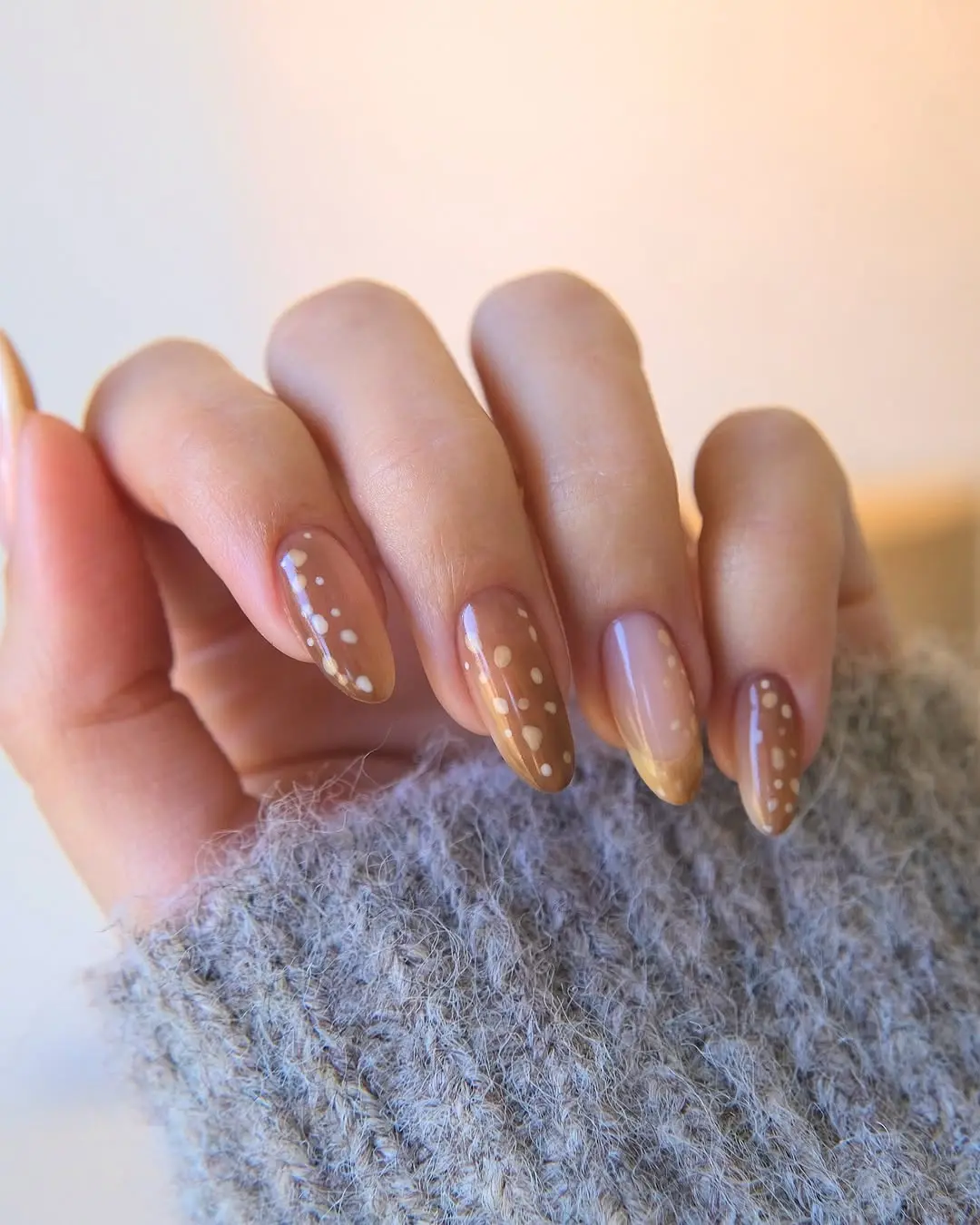 Chic beige winter nails with playful dots