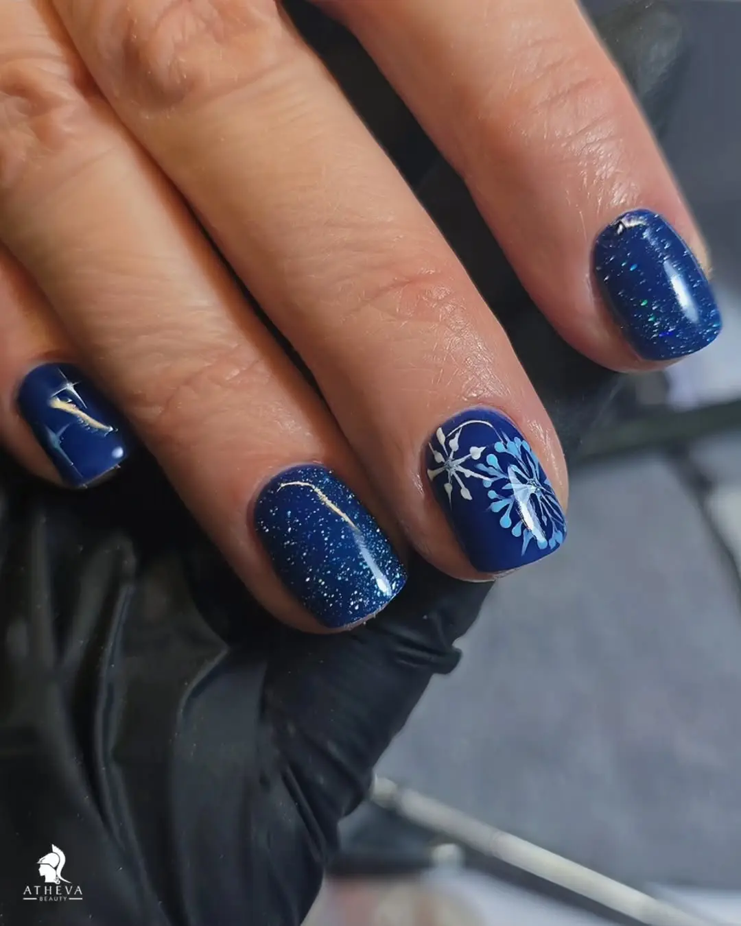 Sparkling blue winter nails with snowflake art